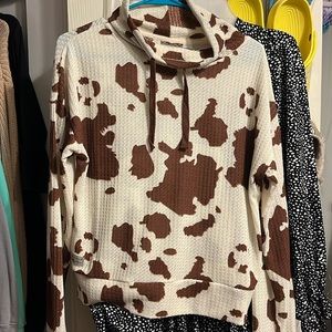 A turtleneck cow, print light jacket